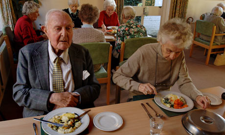 Man and lady eating in a retirement home